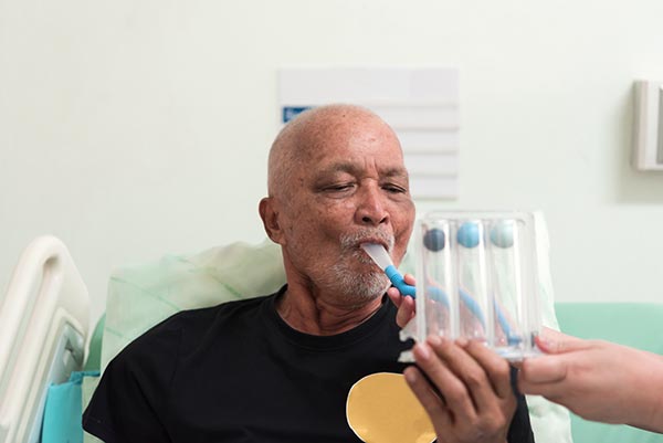 Patient using a spirometer in a Doctor's office